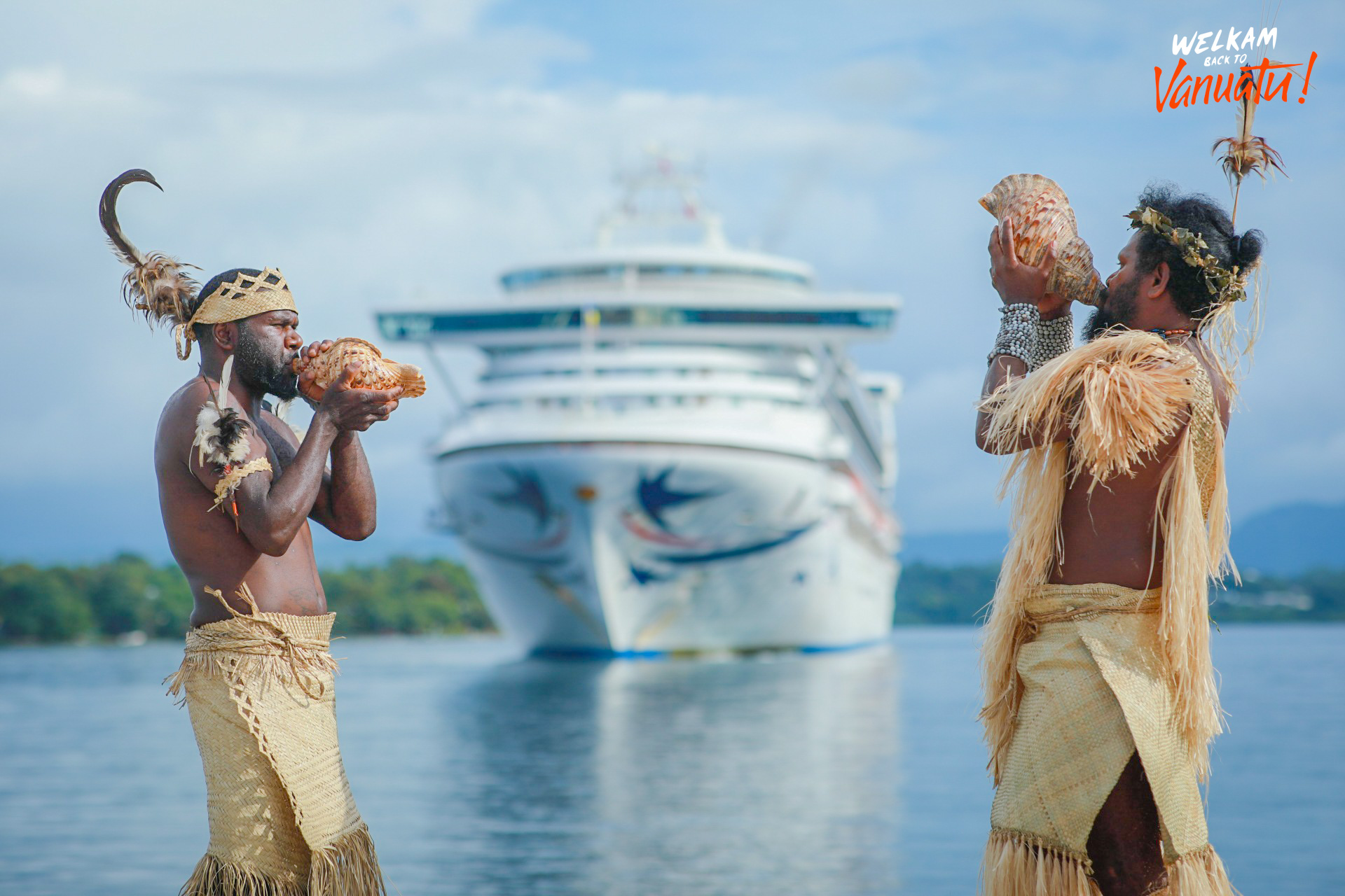 Traditional Vanuatu welcome ceremony beside a visiting cruise ship